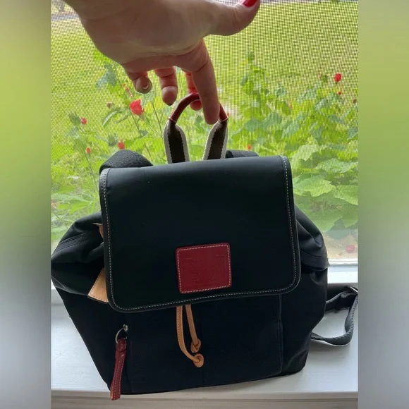 COACH canvas backpack and COACH leather wallet.